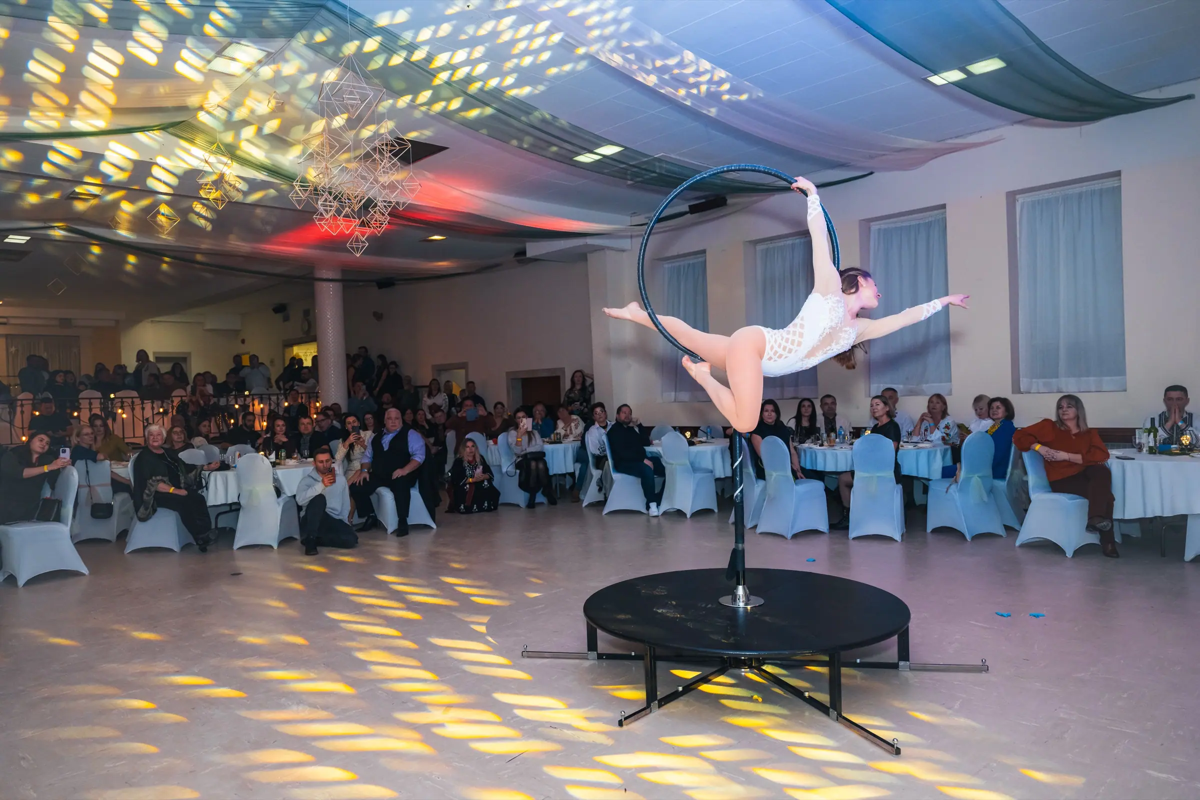 Aerial hoop, between the tables